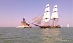 I took this photo at the Toledo Harbor light as the Niagra made its way past the Toledo Harbor light on its way in to Toledo for Navy Week! Beautiful...